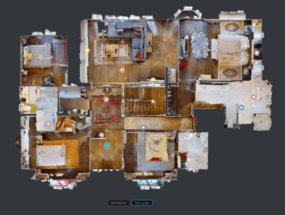 Top-down view of a furnished apartment floor plan with various rooms and furniture placements visible.